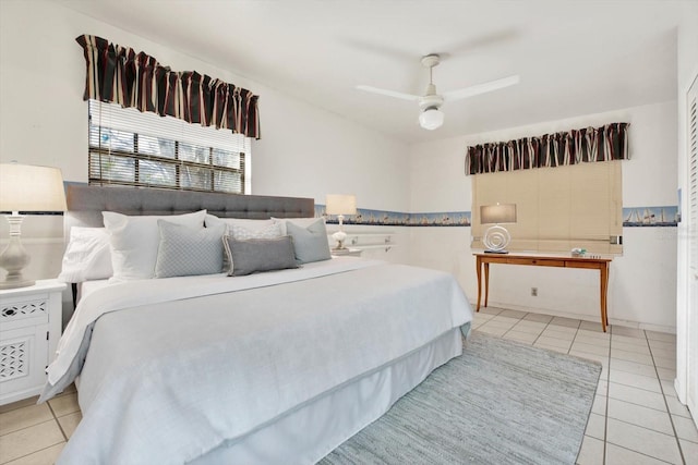 bedroom with light tile patterned floors and ceiling fan