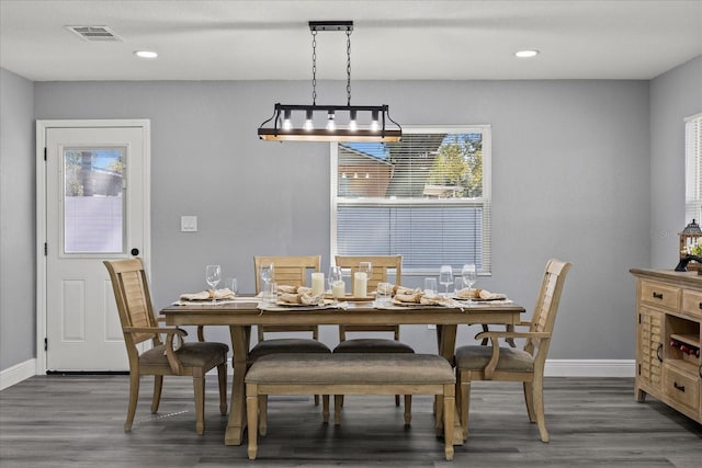 dining room with baseboards, visible vents, wood finished floors, and recessed lighting