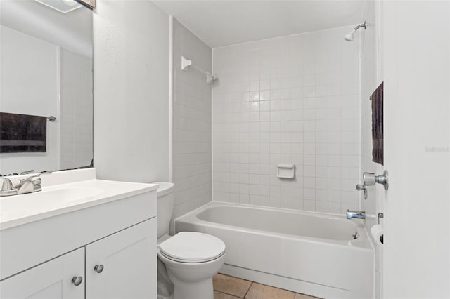 bathroom featuring shower / tub combination, vanity, toilet, and tile patterned floors