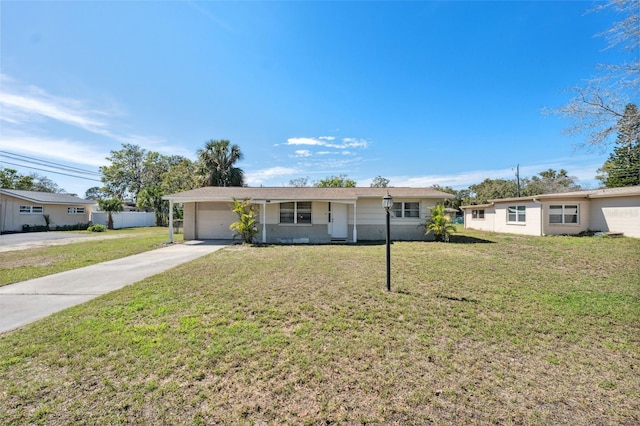 ranch-style house with a garage, concrete driveway, and a front lawn