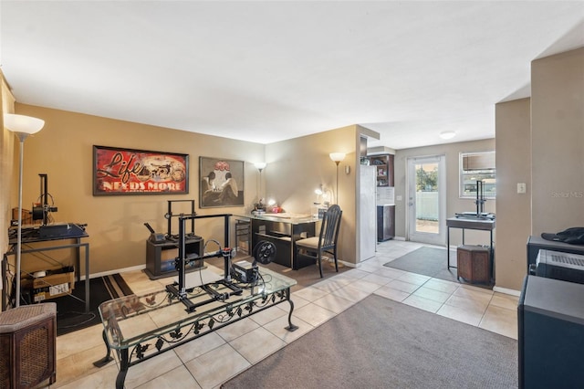 living room with baseboards and tile patterned floors