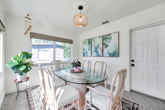 dining space featuring visible vents and baseboards