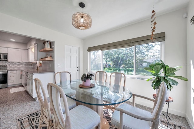 dining room featuring baseboards