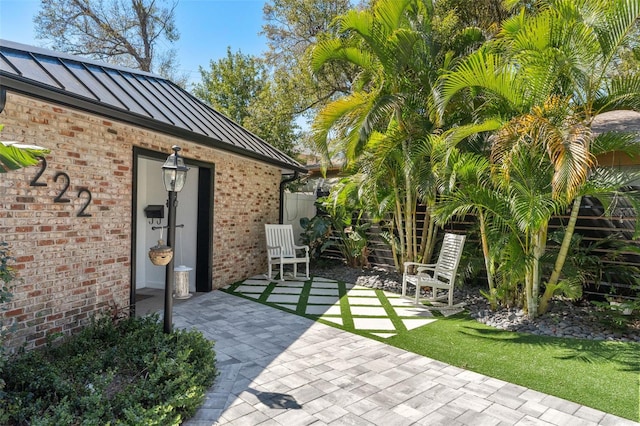 view of patio / terrace featuring fence