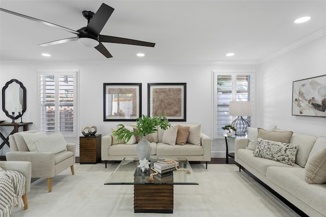 living room featuring recessed lighting, a healthy amount of sunlight, and crown molding