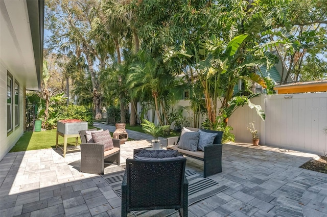 view of patio / terrace featuring an outdoor hangout area and a fenced backyard