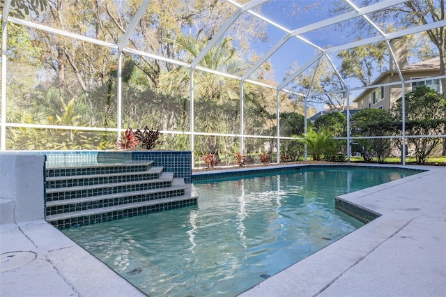 outdoor pool featuring glass enclosure