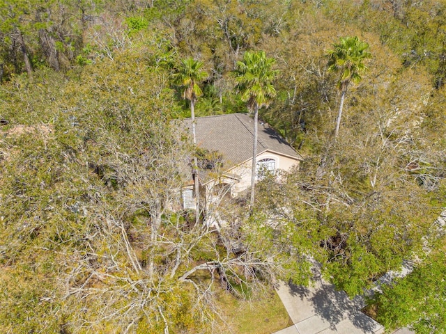 bird's eye view featuring a forest view