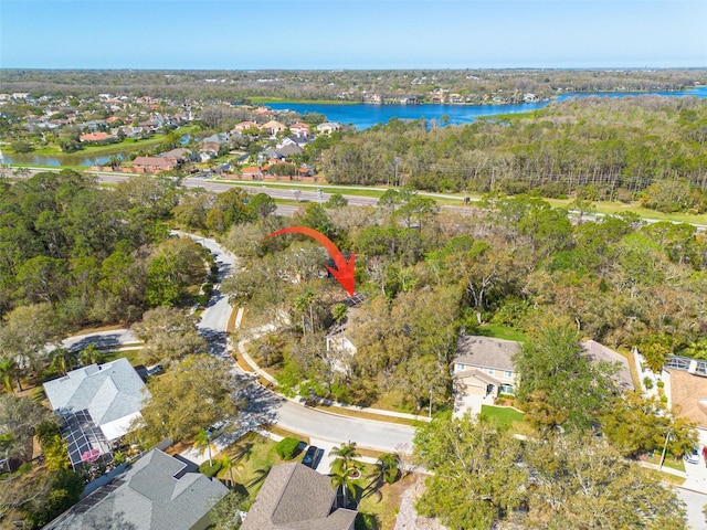 bird's eye view featuring a water view and a residential view