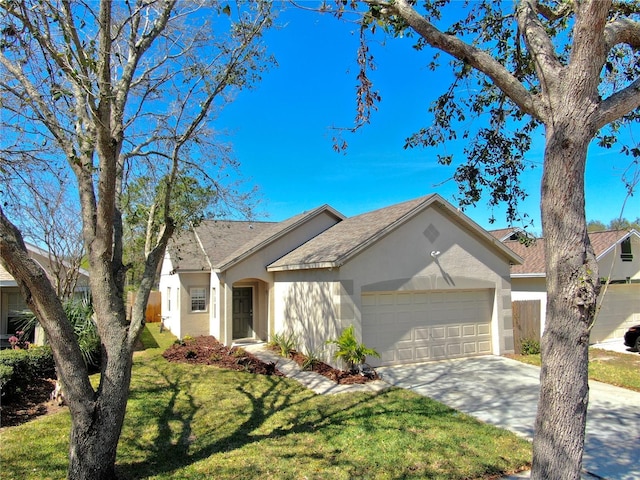 ranch-style home with an attached garage, a front lawn, concrete driveway, and stucco siding