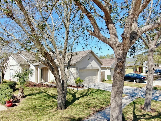 single story home with a garage, driveway, a front lawn, and stucco siding