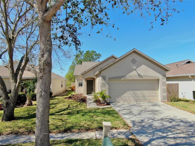 ranch-style house with stucco siding, concrete driveway, fence, a garage, and a front lawn