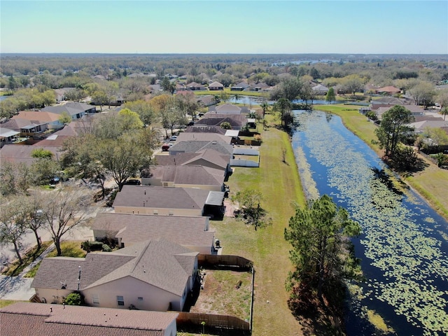 birds eye view of property featuring a water view and a residential view
