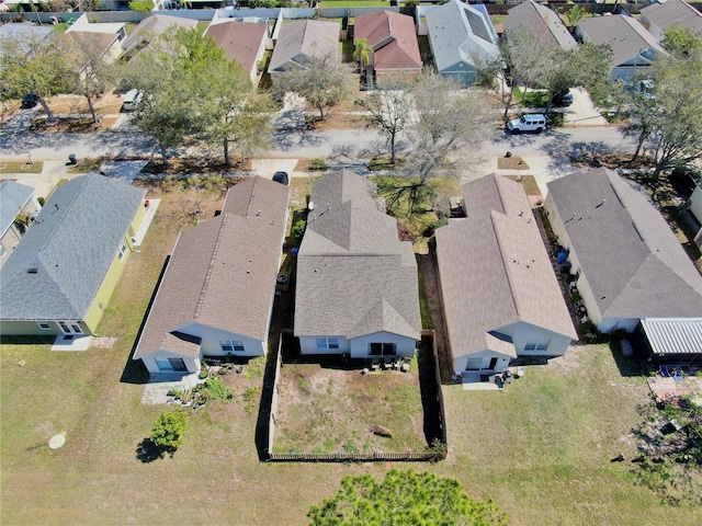 birds eye view of property with a residential view