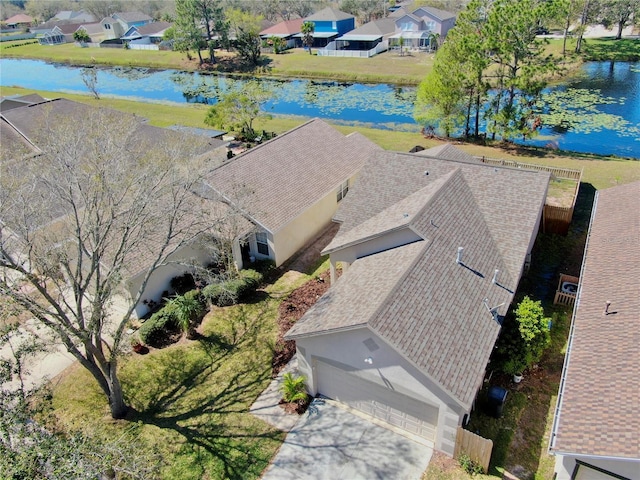 aerial view with a water view and a residential view