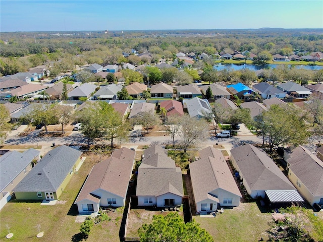 birds eye view of property featuring a residential view and a water view