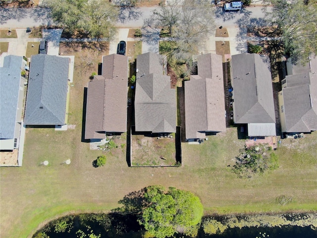 bird's eye view featuring a residential view and a water view