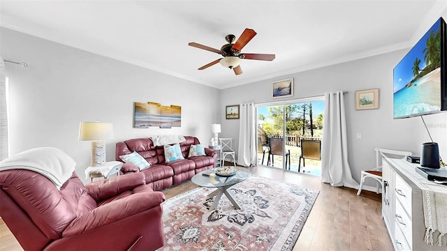 living room with crown molding, light wood-type flooring, and ceiling fan