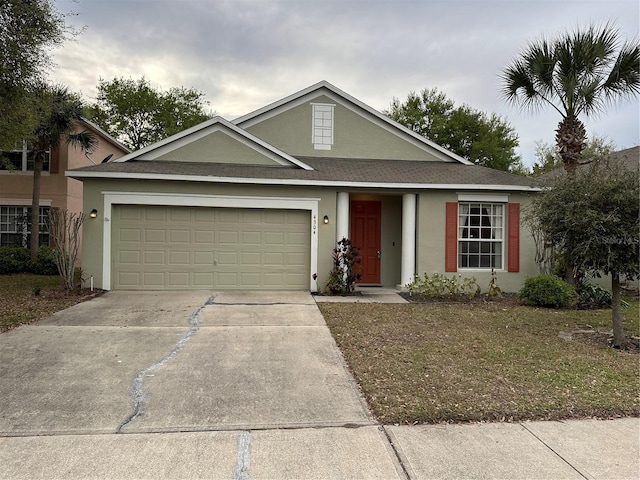 single story home with driveway, a shingled roof, an attached garage, and stucco siding