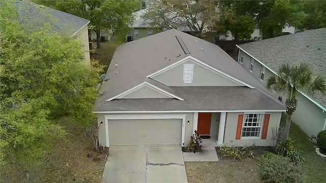 view of front facade with a garage and concrete driveway