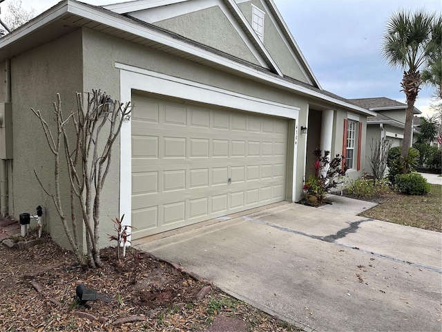 exterior space featuring driveway and stucco siding