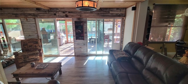 living room featuring wood finished floors and wood ceiling