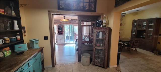 hallway with light tile patterned floors