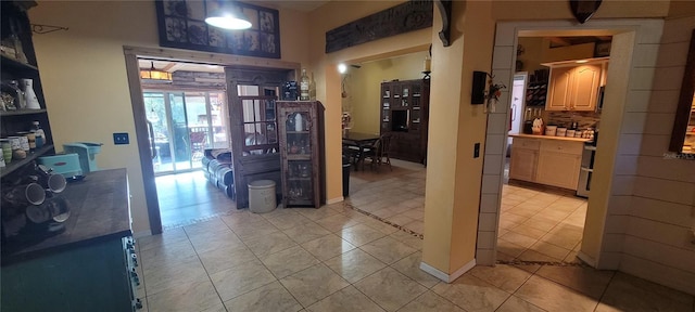 hallway with light tile patterned flooring