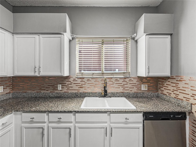 kitchen with white cabinetry, dishwasher, backsplash, and a sink