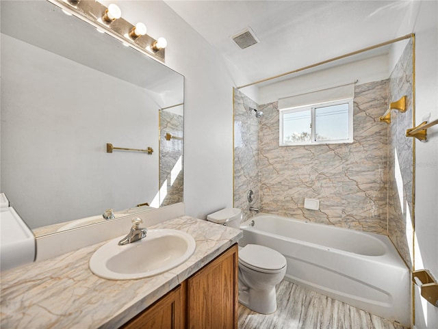 full bathroom with toilet, wood finished floors, vanity, visible vents, and shower / bathing tub combination