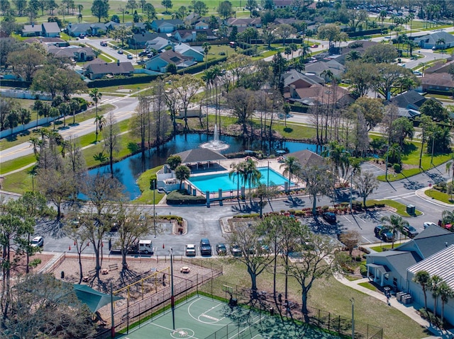 birds eye view of property featuring a water view and a residential view