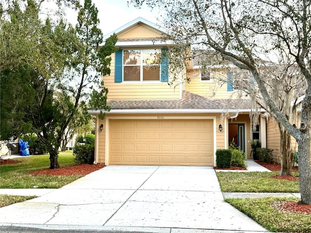 view of front facade featuring concrete driveway, roof with shingles, and an attached garage