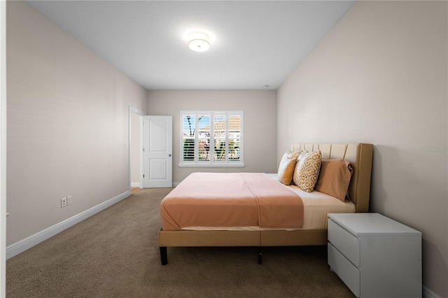 bedroom featuring carpet flooring and baseboards