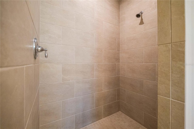 bathroom featuring tiled shower