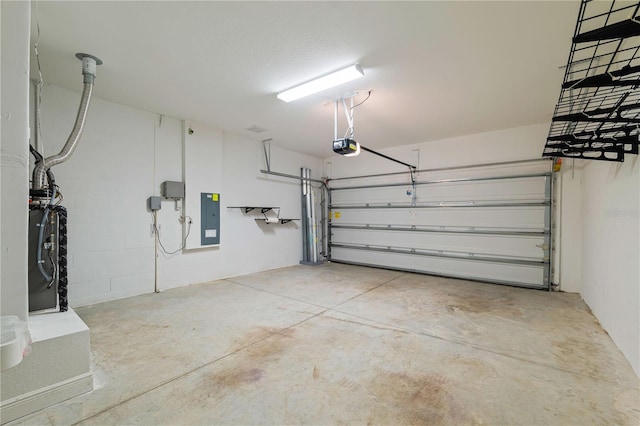 garage featuring electric panel and a garage door opener