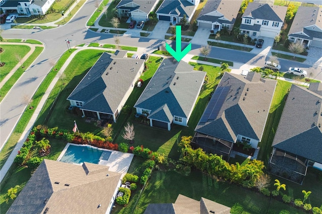 birds eye view of property with a residential view