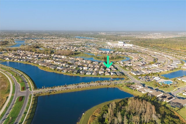 birds eye view of property with a water view and a residential view