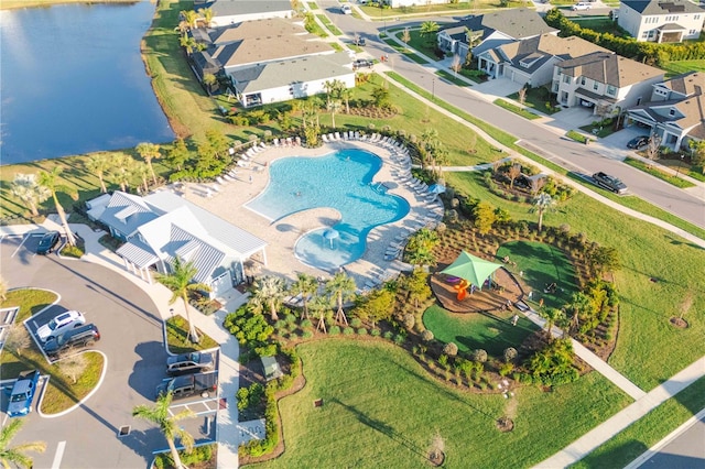 aerial view with a residential view and a water view