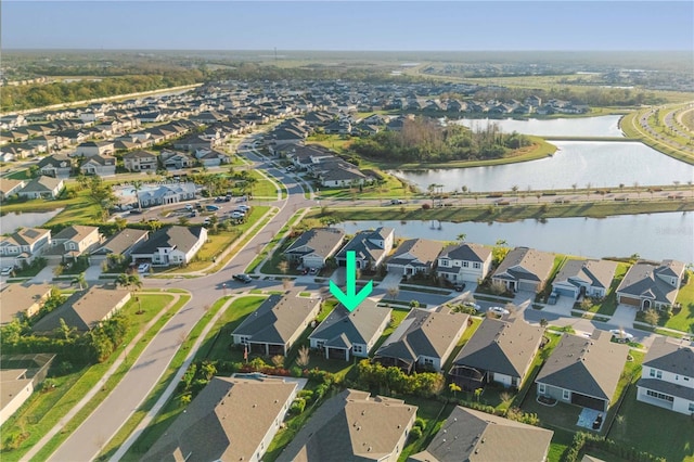 aerial view featuring a water view and a residential view