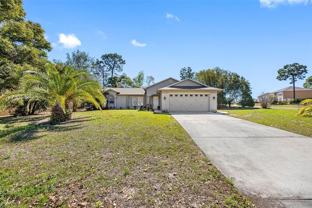 ranch-style home featuring a garage, concrete driveway, and a front yard