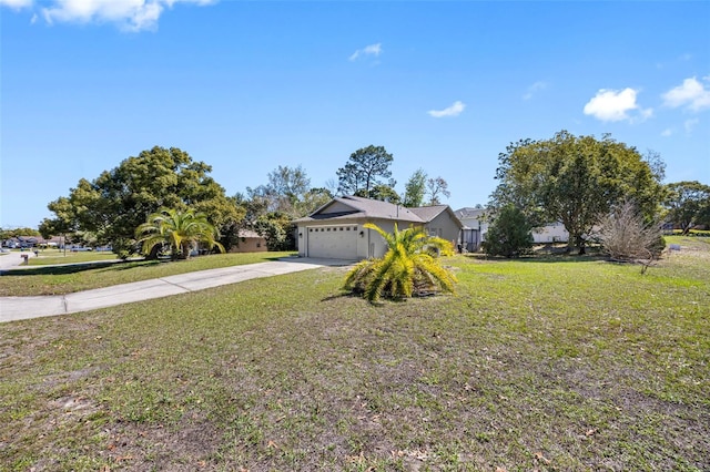 ranch-style home featuring a garage, driveway, and a front lawn