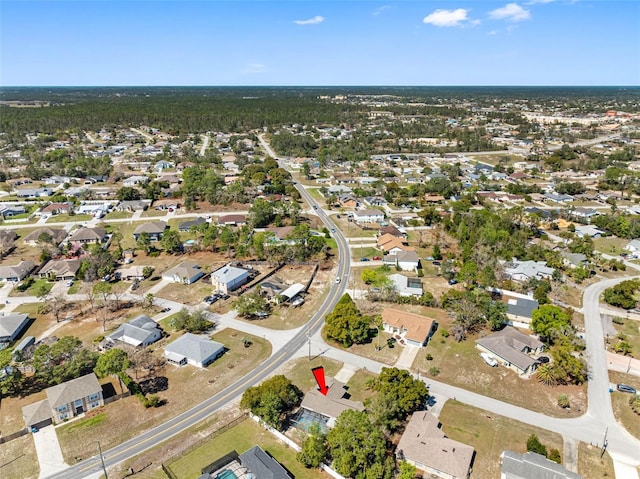 birds eye view of property with a residential view