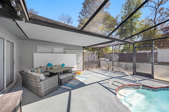 view of patio featuring glass enclosure, a fenced backyard, and an outdoor living space