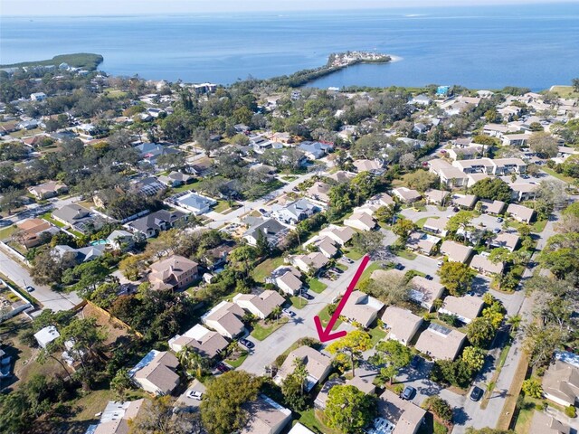 drone / aerial view featuring a residential view and a water view