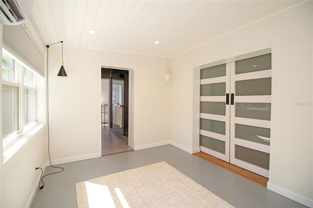 unfurnished room featuring recessed lighting, wood ceiling, baseboards, finished concrete flooring, and a wall mounted air conditioner