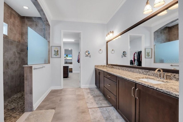 full bathroom featuring crown molding and a sink