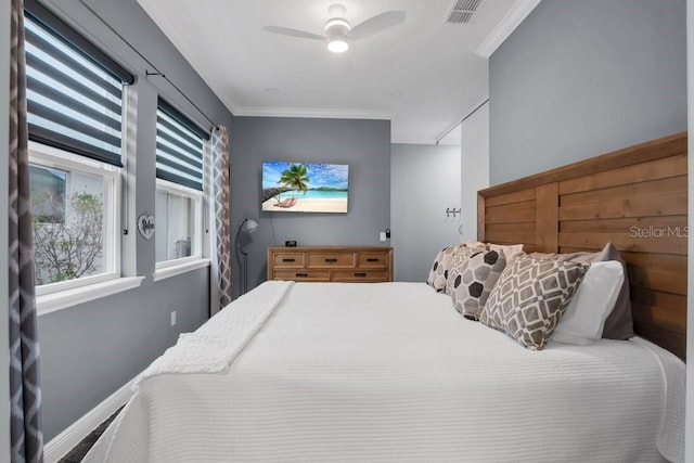 bedroom featuring visible vents, a ceiling fan, and ornamental molding