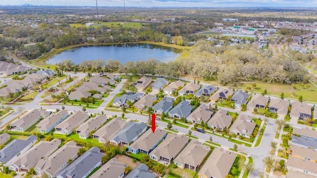 bird's eye view featuring a residential view and a water view