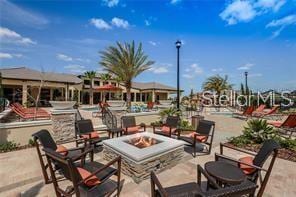 view of patio / terrace with an outdoor fire pit