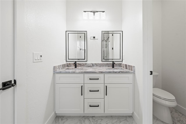 full bath featuring marble finish floor, a sink, and toilet